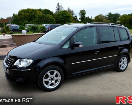 Черный Фольксваген Туран, объемом двигателя 2 л и пробегом 268 тыс. км за 2400 $, фото 1 на Automoto.ua