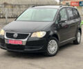 Черный Фольксваген Туран, объемом двигателя 1.6 л и пробегом 193 тыс. км за 7799 $, фото 1 на Automoto.ua