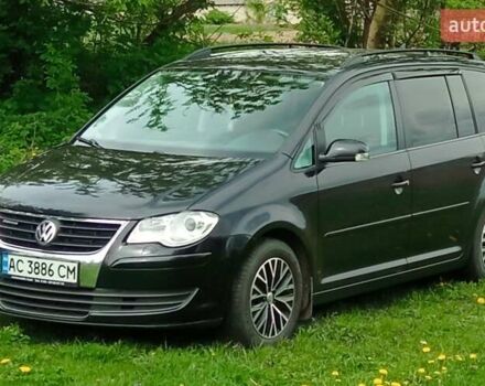 Черный Фольксваген Туран, объемом двигателя 1.9 л и пробегом 293 тыс. км за 7000 $, фото 1 на Automoto.ua