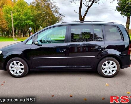 Черный Фольксваген Туран, объемом двигателя 2 л и пробегом 318 тыс. км за 2400 $, фото 1 на Automoto.ua