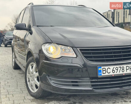 Черный Фольксваген Туран, объемом двигателя 1.4 л и пробегом 247 тыс. км за 7500 $, фото 1 на Automoto.ua