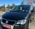 Черный Фольксваген Туран, объемом двигателя 1.4 л и пробегом 145 тыс. км за 7450 $, фото 1 на Automoto.ua