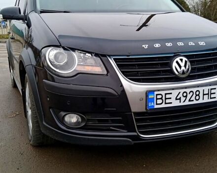 Черный Фольксваген Туран, объемом двигателя 1.4 л и пробегом 225 тыс. км за 8100 $, фото 1 на Automoto.ua