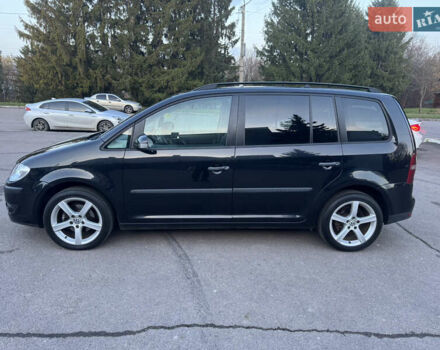 Черный Фольксваген Туран, объемом двигателя 1.4 л и пробегом 224 тыс. км за 6499 $, фото 2 на Automoto.ua