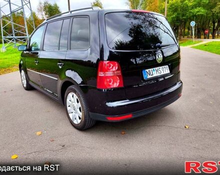 Черный Фольксваген Туран, объемом двигателя 2 л и пробегом 318 тыс. км за 2400 $, фото 2 на Automoto.ua