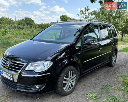 Черный Фольксваген Туран, объемом двигателя 1.39 л и пробегом 191 тыс. км за 8500 $, фото 1 на Automoto.ua