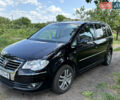 Черный Фольксваген Туран, объемом двигателя 1.39 л и пробегом 191 тыс. км за 8500 $, фото 1 на Automoto.ua