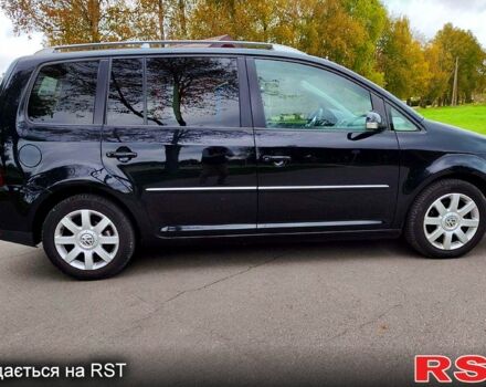 Черный Фольксваген Туран, объемом двигателя 2 л и пробегом 318 тыс. км за 2400 $, фото 4 на Automoto.ua