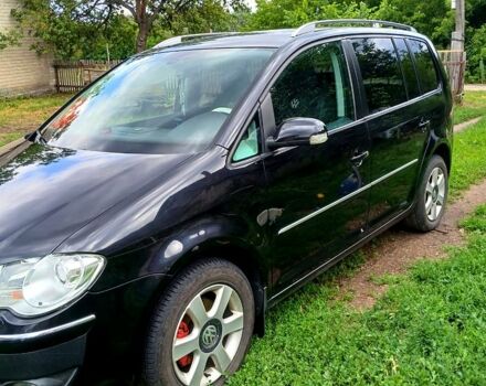 Черный Фольксваген Туран, объемом двигателя 1.4 л и пробегом 240 тыс. км за 6500 $, фото 2 на Automoto.ua