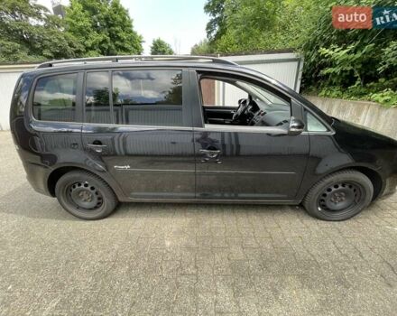 Черный Фольксваген Туран, объемом двигателя 1.4 л и пробегом 190 тыс. км за 5313 $, фото 1 на Automoto.ua