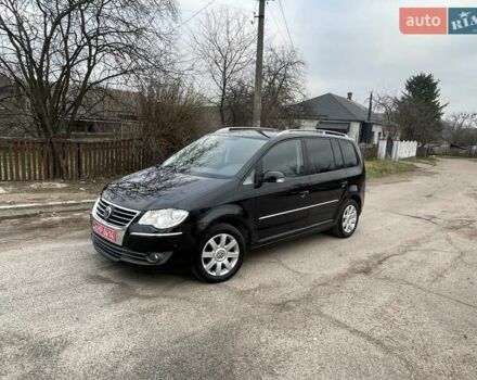 Черный Фольксваген Туран, объемом двигателя 1.4 л и пробегом 194 тыс. км за 6555 $, фото 184 на Automoto.ua