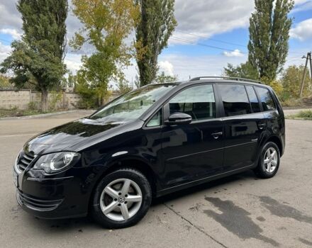 Черный Фольксваген Туран, объемом двигателя 1.4 л и пробегом 237 тыс. км за 6850 $, фото 1 на Automoto.ua