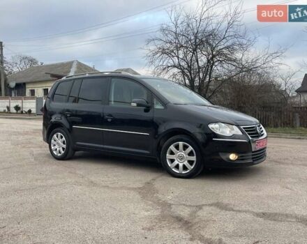 Черный Фольксваген Туран, объемом двигателя 1.4 л и пробегом 194 тыс. км за 6555 $, фото 175 на Automoto.ua