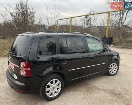 Черный Фольксваген Туран, объемом двигателя 1.4 л и пробегом 194 тыс. км за 6555 $, фото 88 на Automoto.ua