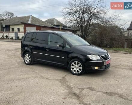 Черный Фольксваген Туран, объемом двигателя 1.4 л и пробегом 194 тыс. км за 6555 $, фото 174 на Automoto.ua