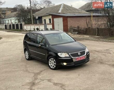 Черный Фольксваген Туран, объемом двигателя 1.4 л и пробегом 194 тыс. км за 6555 $, фото 170 на Automoto.ua