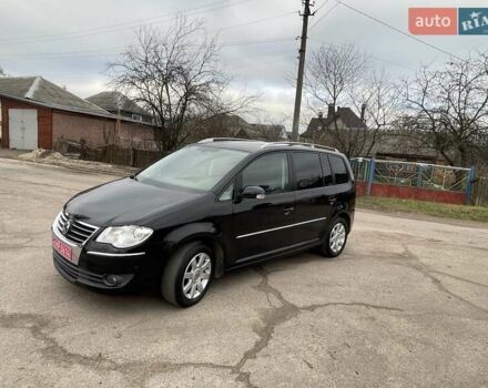 Черный Фольксваген Туран, объемом двигателя 1.4 л и пробегом 194 тыс. км за 6555 $, фото 73 на Automoto.ua