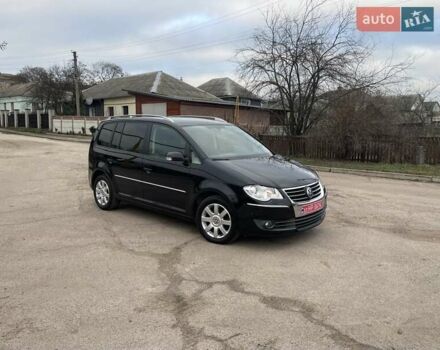 Черный Фольксваген Туран, объемом двигателя 1.4 л и пробегом 194 тыс. км за 6555 $, фото 180 на Automoto.ua