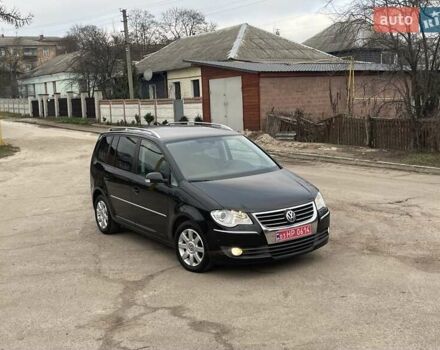 Черный Фольксваген Туран, объемом двигателя 1.4 л и пробегом 194 тыс. км за 6555 $, фото 169 на Automoto.ua