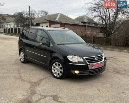 Черный Фольксваген Туран, объемом двигателя 1.4 л и пробегом 194 тыс. км за 6555 $, фото 172 на Automoto.ua