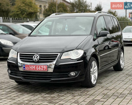 Черный Фольксваген Туран, объемом двигателя 1.4 л и пробегом 195 тыс. км за 7600 $, фото 2 на Automoto.ua
