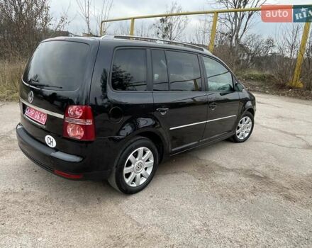 Черный Фольксваген Туран, объемом двигателя 1.4 л и пробегом 194 тыс. км за 6555 $, фото 95 на Automoto.ua