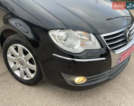Черный Фольксваген Туран, объемом двигателя 1.4 л и пробегом 194 тыс. км за 6555 $, фото 178 на Automoto.ua