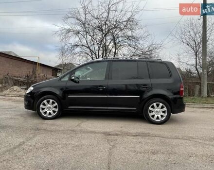 Черный Фольксваген Туран, объемом двигателя 1.4 л и пробегом 194 тыс. км за 6555 $, фото 185 на Automoto.ua