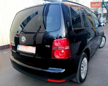 Черный Фольксваген Туран, объемом двигателя 1.4 л и пробегом 193 тыс. км за 6600 $, фото 16 на Automoto.ua