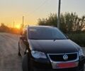 Черный Фольксваген Туран, объемом двигателя 1.4 л и пробегом 194 тыс. км за 7300 $, фото 1 на Automoto.ua