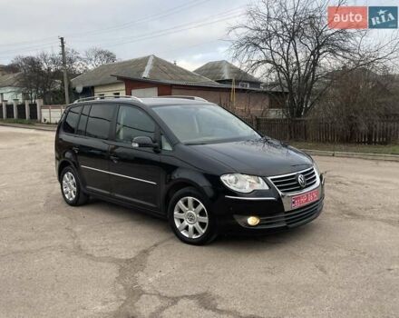 Черный Фольксваген Туран, объемом двигателя 1.4 л и пробегом 194 тыс. км за 6555 $, фото 171 на Automoto.ua