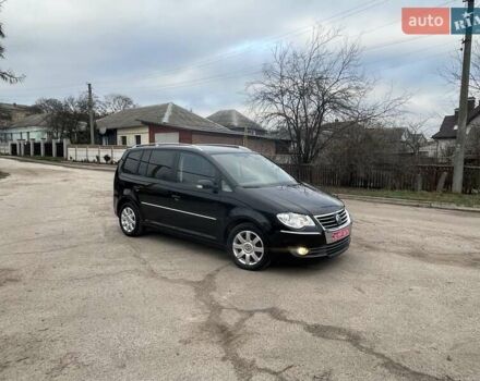 Черный Фольксваген Туран, объемом двигателя 1.4 л и пробегом 194 тыс. км за 6555 $, фото 176 на Automoto.ua