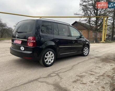 Черный Фольксваген Туран, объемом двигателя 1.4 л и пробегом 194 тыс. км за 6555 $, фото 192 на Automoto.ua