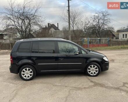 Черный Фольксваген Туран, объемом двигателя 1.4 л и пробегом 194 тыс. км за 6555 $, фото 181 на Automoto.ua