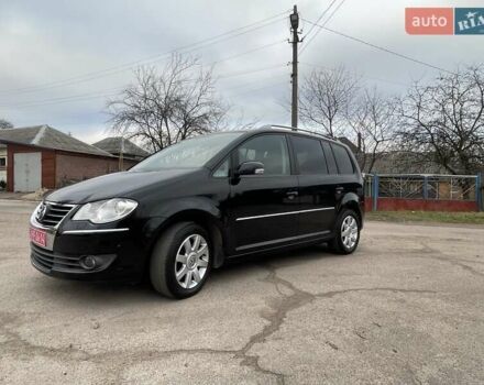 Черный Фольксваген Туран, объемом двигателя 1.4 л и пробегом 194 тыс. км за 6555 $, фото 74 на Automoto.ua
