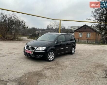 Черный Фольксваген Туран, объемом двигателя 1.4 л и пробегом 194 тыс. км за 6555 $, фото 101 на Automoto.ua