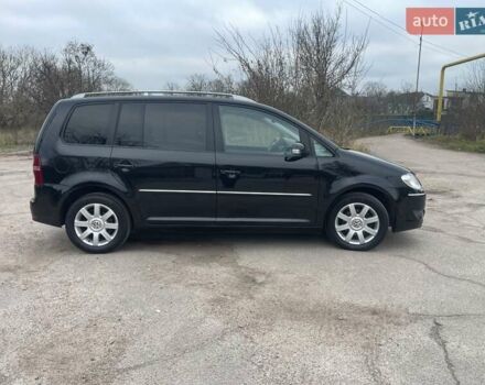 Черный Фольксваген Туран, объемом двигателя 1.4 л и пробегом 194 тыс. км за 6555 $, фото 87 на Automoto.ua