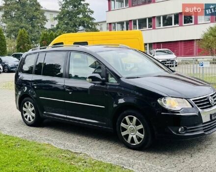 Черный Фольксваген Туран, объемом двигателя 1.4 л и пробегом 194 тыс. км за 6555 $, фото 226 на Automoto.ua
