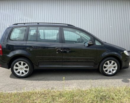 Черный Фольксваген Туран, объемом двигателя 1.4 л и пробегом 203 тыс. км за 6550 $, фото 1 на Automoto.ua