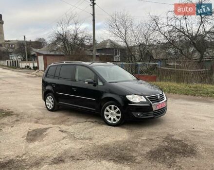 Черный Фольксваген Туран, объемом двигателя 1.4 л и пробегом 194 тыс. км за 6555 $, фото 2 на Automoto.ua