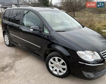 Черный Фольксваген Туран, объемом двигателя 1.4 л и пробегом 194 тыс. км за 6555 $, фото 86 на Automoto.ua