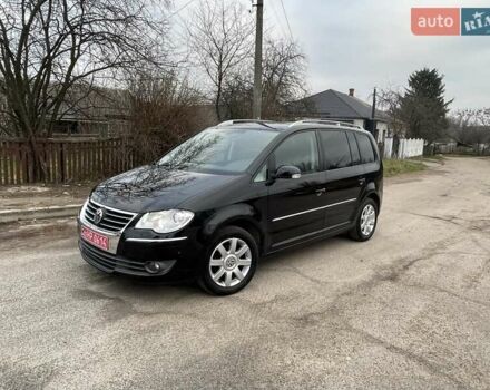 Черный Фольксваген Туран, объемом двигателя 1.4 л и пробегом 194 тыс. км за 6555 $, фото 183 на Automoto.ua