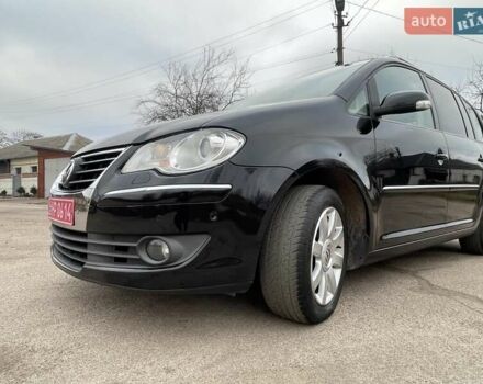 Черный Фольксваген Туран, объемом двигателя 1.4 л и пробегом 194 тыс. км за 6555 $, фото 76 на Automoto.ua