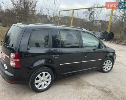 Черный Фольксваген Туран, объемом двигателя 1.4 л и пробегом 194 тыс. км за 6555 $, фото 97 на Automoto.ua