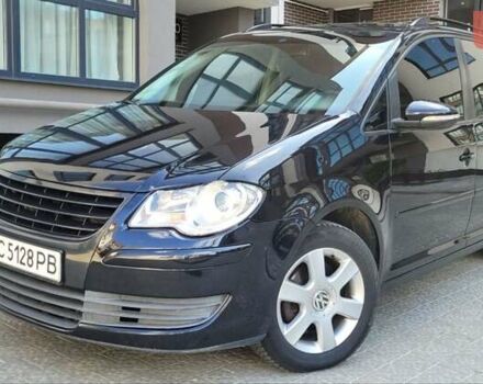 Черный Фольксваген Туран, объемом двигателя 1.97 л и пробегом 248 тыс. км за 8300 $, фото 1 на Automoto.ua