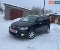 Черный Фольксваген Туран, объемом двигателя 1.4 л и пробегом 246 тыс. км за 7444 $, фото 1 на Automoto.ua
