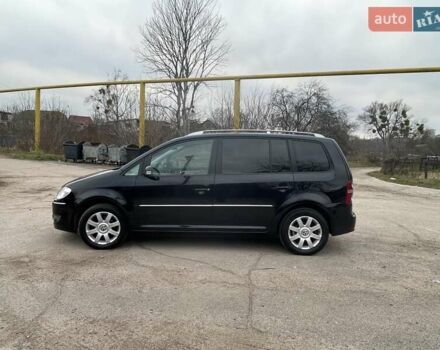 Черный Фольксваген Туран, объемом двигателя 1.4 л и пробегом 194 тыс. км за 6555 $, фото 102 на Automoto.ua