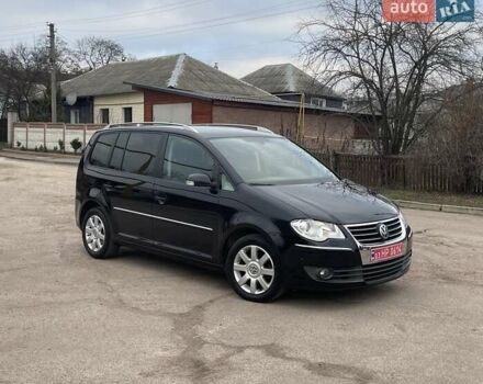 Черный Фольксваген Туран, объемом двигателя 1.4 л и пробегом 194 тыс. км за 6555 $, фото 179 на Automoto.ua