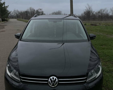 Черный Фольксваген Туран, объемом двигателя 1.6 л и пробегом 259 тыс. км за 11200 $, фото 1 на Automoto.ua