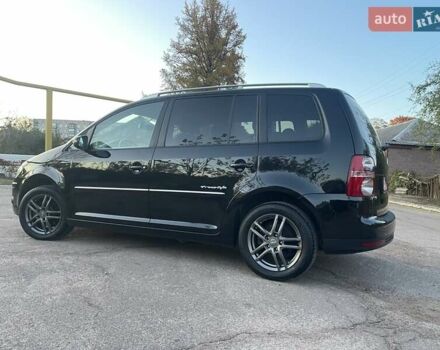 Черный Фольксваген Туран, объемом двигателя 1.4 л и пробегом 238 тыс. км за 7888 $, фото 78 на Automoto.ua